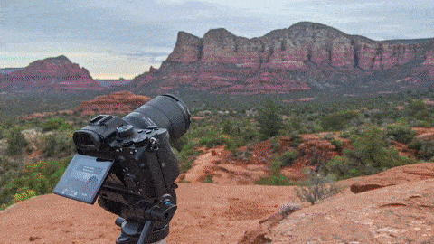 person pointing white paper on wall